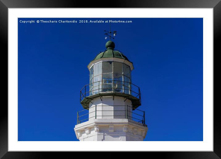 Deserted lighthouse against blue background. Framed Mounted Print by Theocharis Charitonidis