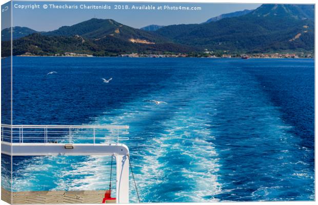 Cart Ferry sailing with seagulls flying along. Canvas Print by Theocharis Charitonidis