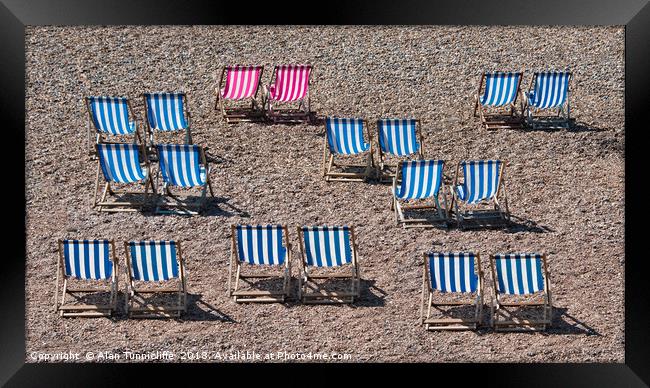 Deck chairs on the beach Framed Print by Alan Tunnicliffe