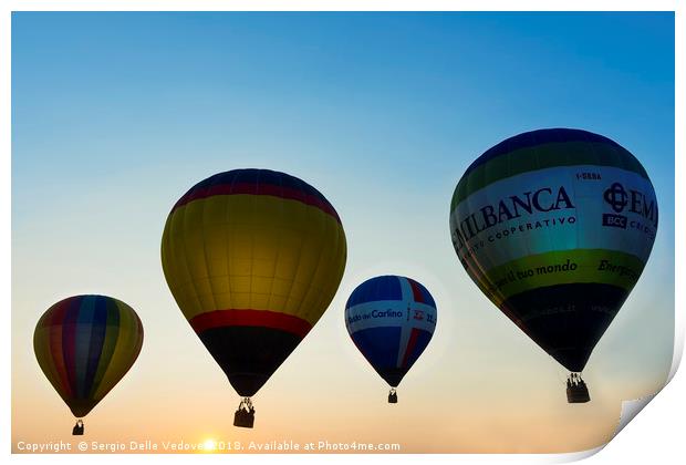 Balloons flying at the sunset Print by Sergio Delle Vedove