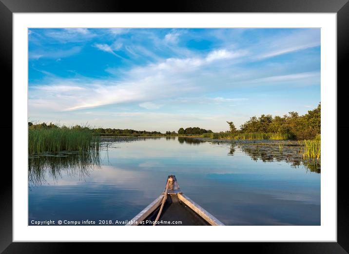 boat on the lake with green plants in twilight Framed Mounted Print by Chris Willemsen