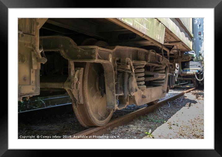 old rosted dirty wheels from train on railroad Framed Mounted Print by Chris Willemsen