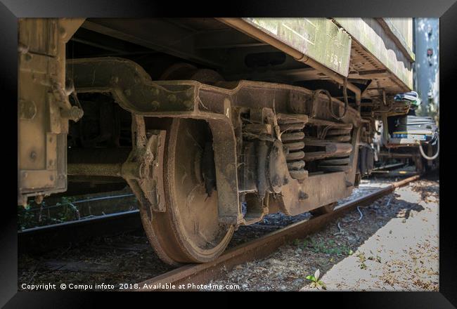 old rosted dirty wheels from train on railroad Framed Print by Chris Willemsen