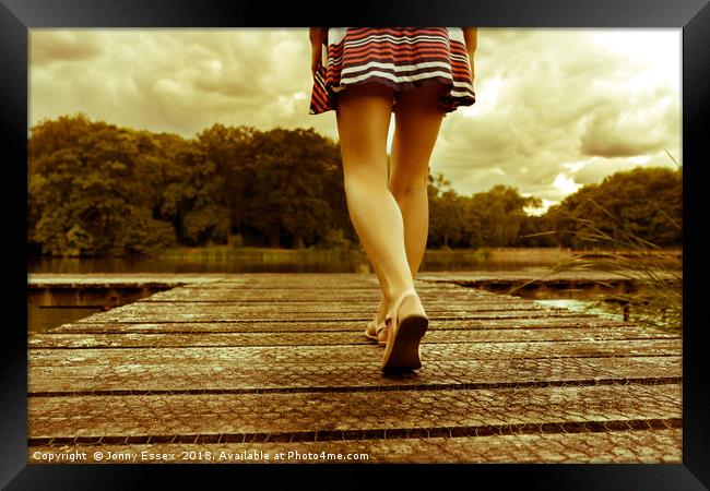 Lady with a perfect figure walking on a jetty Framed Print by Jonny Essex