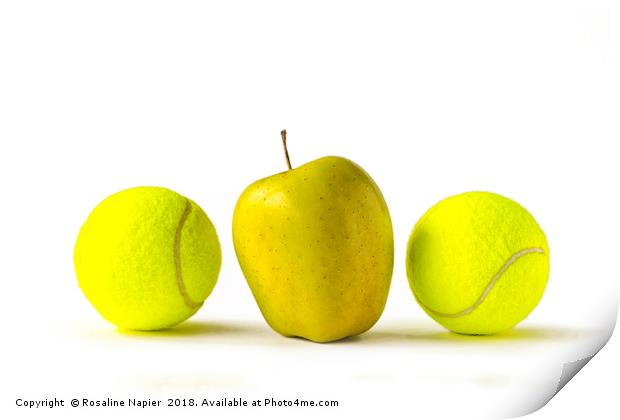 Yellow apple between two tennis balls Print by Rosaline Napier