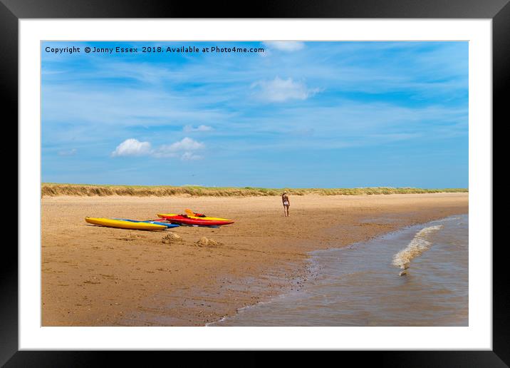 A stroll along the beach past some kayaks, canoes Framed Mounted Print by Jonny Essex