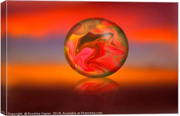 Glass globe on sunset background Canvas Print by Rosaline Napier