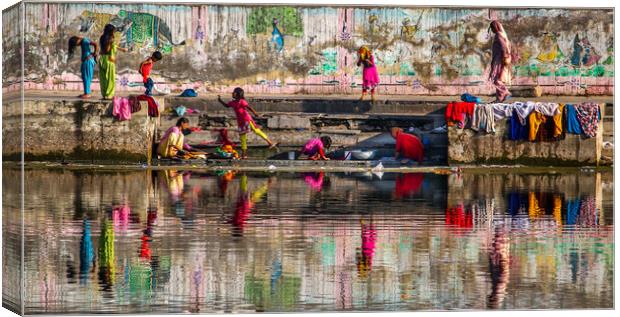 Indian family washing in lake Canvas Print by tim miller