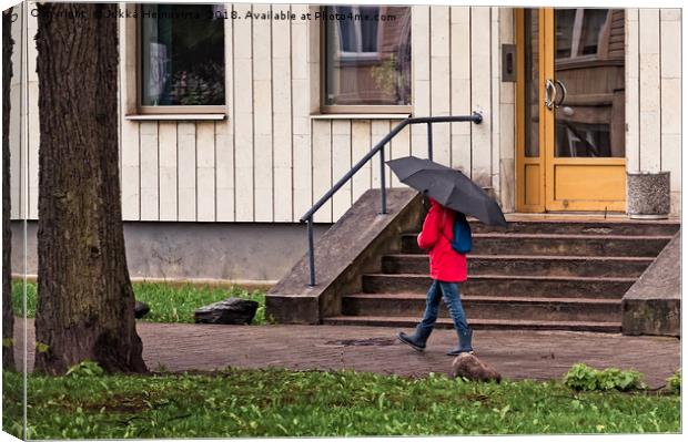 Walking With Umbrella Canvas Print by Jukka Heinovirta