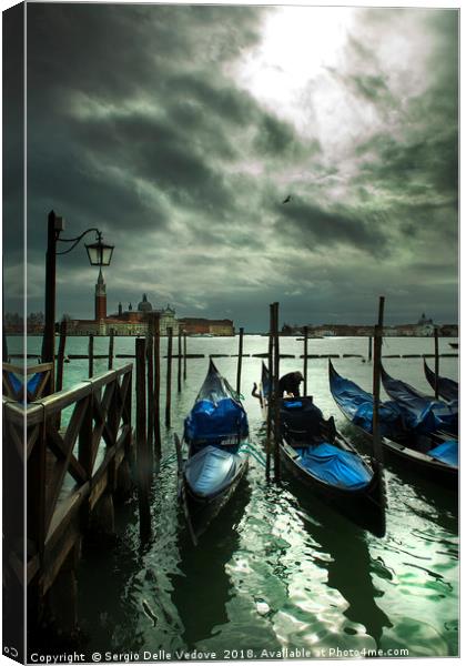 Gondolas on the lagoon in Venice Canvas Print by Sergio Delle Vedove