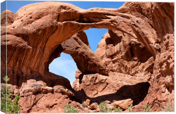 Double arch in Utah park during summer time  Canvas Print by Thomas Baker