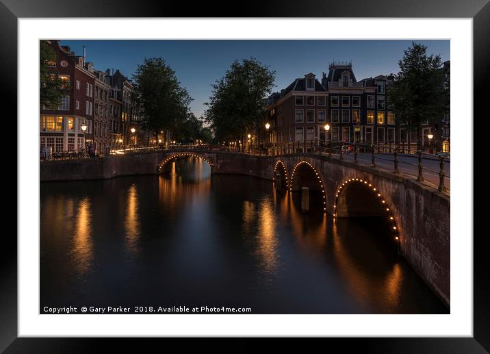 Amsterdam canal and bridge, at dusk.  Framed Mounted Print by Gary Parker