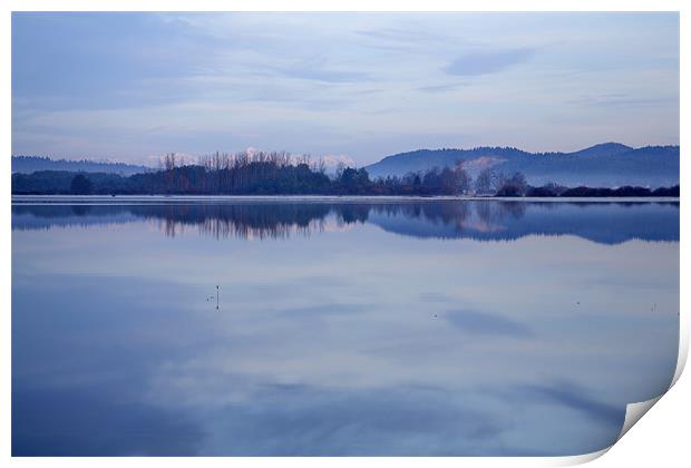 Cerknica lake at dawn with snow covered alps Print by Ian Middleton