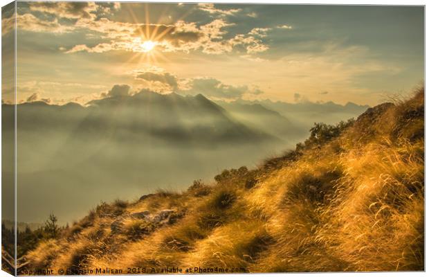 The Sun Sets Over The Mountains Canvas Print by Fabrizio Malisan