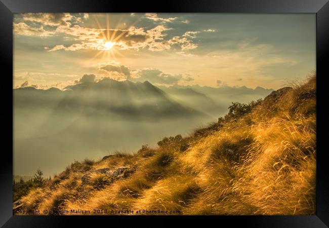 The Sun Sets Over The Mountains Framed Print by Fabrizio Malisan