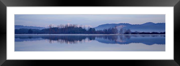 Cerknica lake at dawn with snow covered alps Framed Mounted Print by Ian Middleton