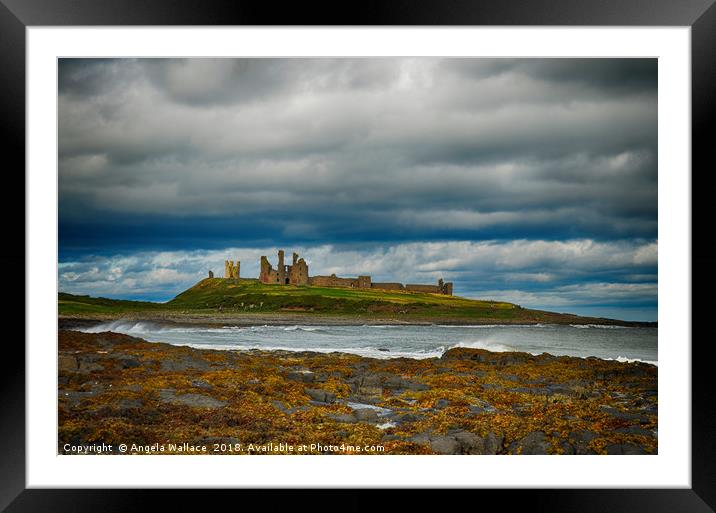 Dunstanburgh Castle on a blustery day Framed Mounted Print by Angela Wallace
