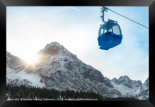 Cable car and snow-capped mountains Framed Print by Daniela Simona Temneanu