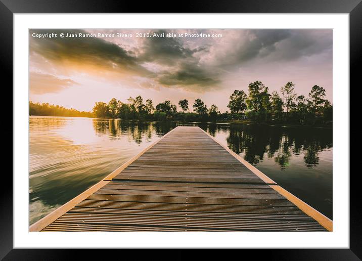 Wooden jetty over the lake at sunset in a sky with Framed Mounted Print by Juan Ramón Ramos Rivero