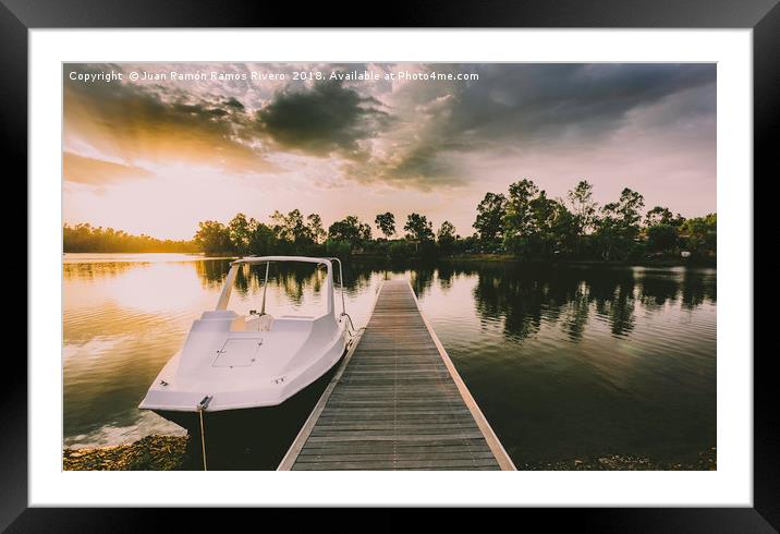Pleasure boat moored to the wooden pier at sunset  Framed Mounted Print by Juan Ramón Ramos Rivero