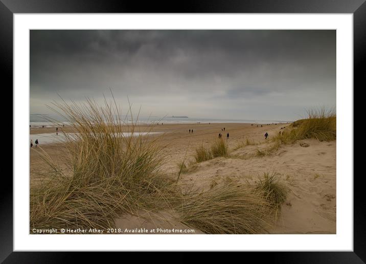 Moody day at Bamburgh beach, Northumberland Framed Mounted Print by Heather Athey