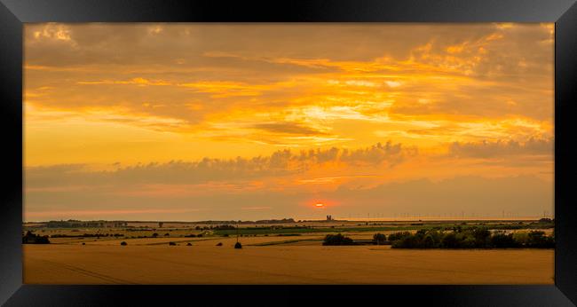 Sunset across the marshes to Reculver Towers Framed Print by Robin Lee