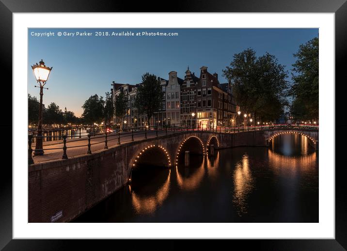 Amsterdam canal and bridge, at dusk.  Framed Mounted Print by Gary Parker