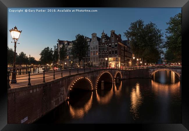 Amsterdam canal and bridge, at dusk.  Framed Print by Gary Parker