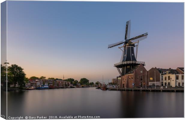 Dutch windmill, in the town of Haarlem, at sunset. Canvas Print by Gary Parker