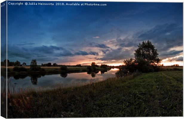 Autumn Sunset By The River Canvas Print by Jukka Heinovirta