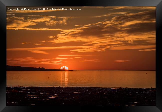 Reculver Towers silhoutted by the setting sun Framed Print by Robin Lee