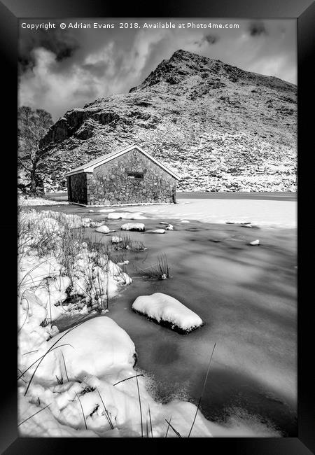 Frrozen Lake Snowdonia  Framed Print by Adrian Evans