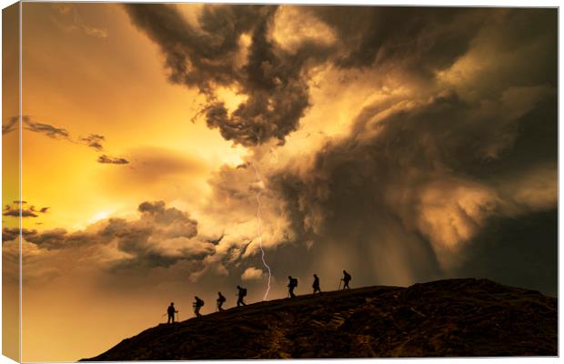 Hikers on the storm Canvas Print by John Finney