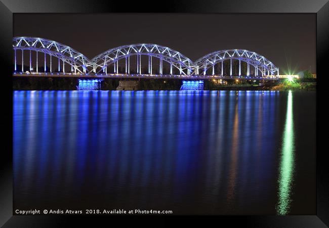 Railway Bridge crosses the Daugava river in Riga Framed Print by Andis Atvars
