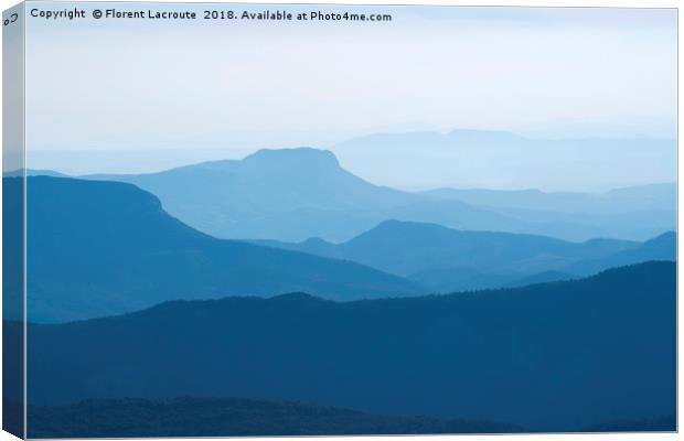 Blue layers of mountain ridges in the french alps Canvas Print by Florent Lacroute