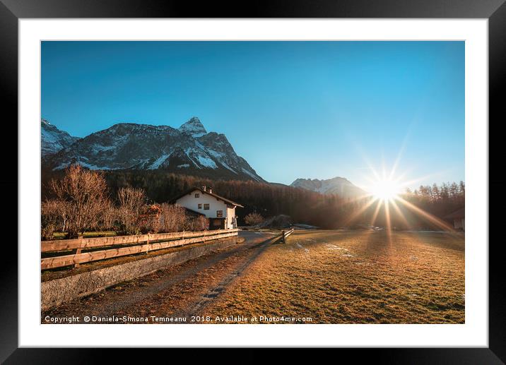 Winter sunshine over Austrian Alps and village Framed Mounted Print by Daniela Simona Temneanu