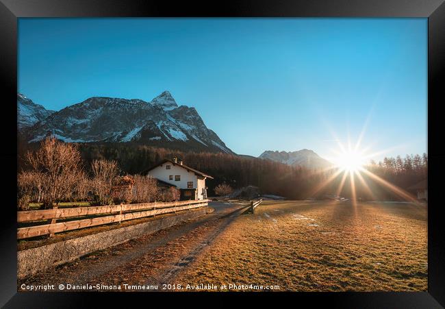 Winter sunshine over Austrian Alps and village Framed Print by Daniela Simona Temneanu