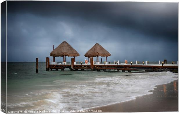 pier with a pair of palapa's              Canvas Print by Angela Wallace