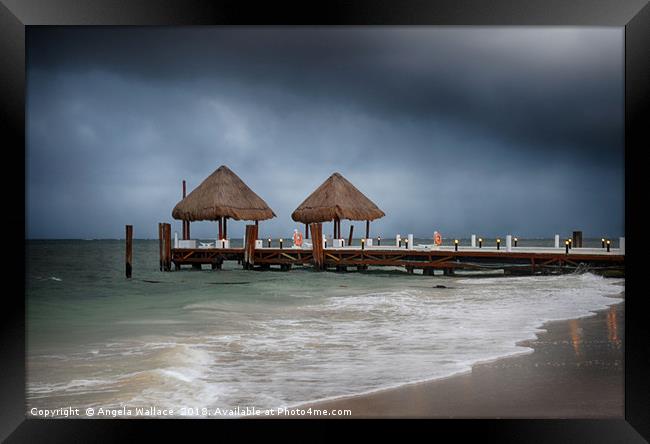 pier with a pair of palapa's              Framed Print by Angela Wallace