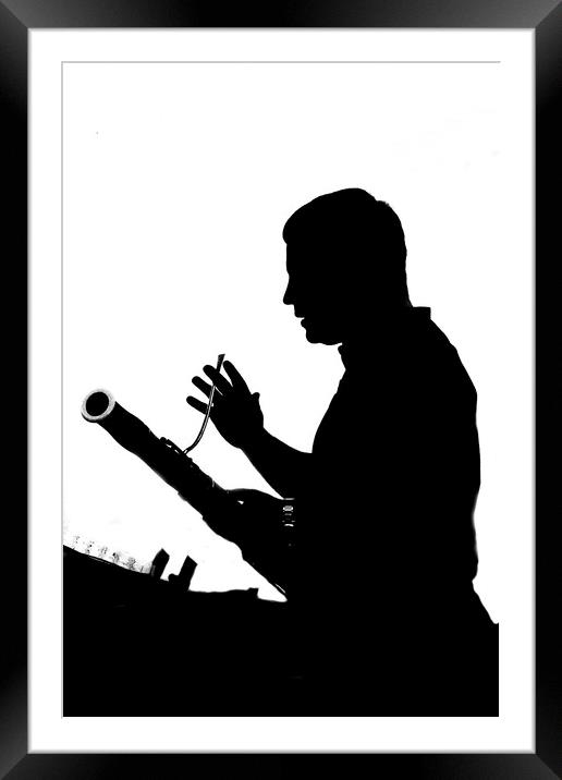 Bassoon soloist in silhouette Framed Mounted Print by Alan Humphreys