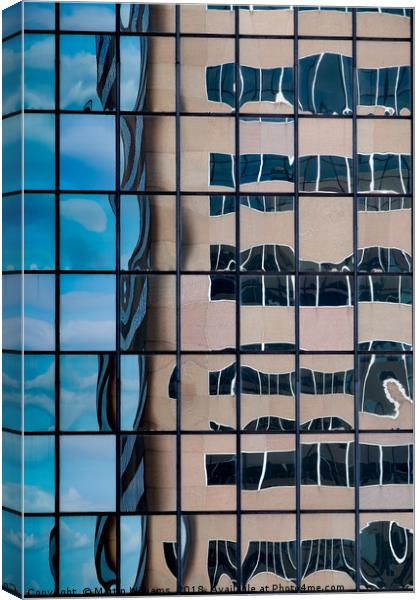 A distorted reflection of an office block in the r Canvas Print by Martin Williams