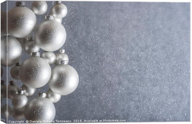 Light silver Christmas balls and snowstorm Canvas Print by Daniela Simona Temneanu