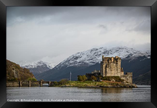 Eileen Donan Castle Against Snowy Mountains Framed Print by Rosalind White