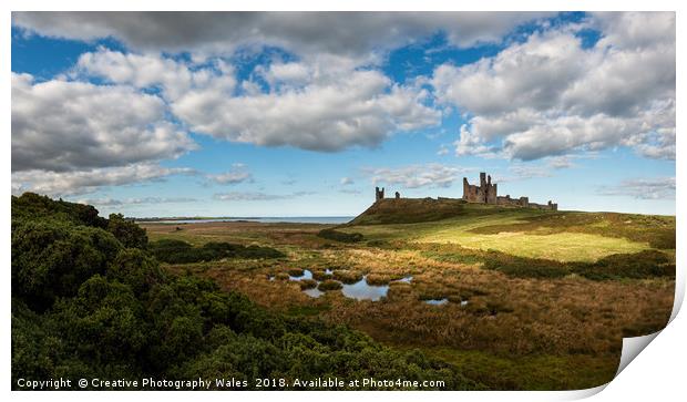 Dunstanburgh Castle on the Northumberland Coast Print by Creative Photography Wales