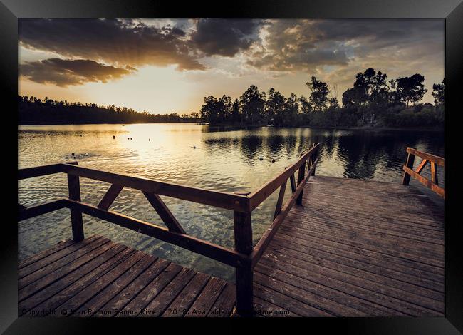 Pier with wooden railing and trees Framed Print by Juan Ramón Ramos Rivero
