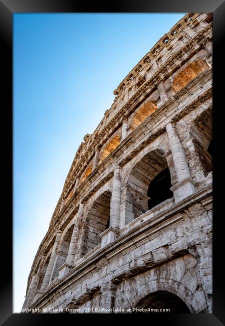 Close up perspective of the Colosseum Framed Print by Claire Turner