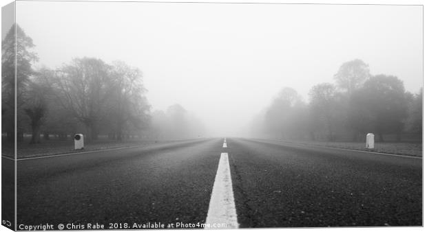 Low view down Foggy road  Canvas Print by Chris Rabe