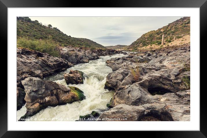 Rapids of the river with rock covered with moss Framed Mounted Print by Juan Ramón Ramos Rivero