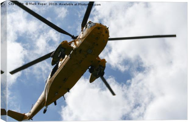 Sea King Search and Rescue Helicopter From Below Canvas Print by Mark Roper
