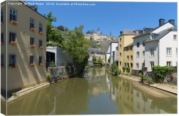 Sunny alzette river scene in Luxembourg from Rue M Canvas Print by Mark Roper